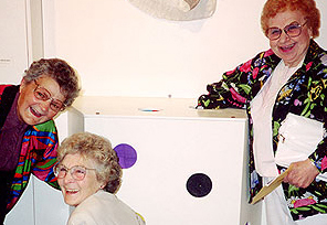 elderly ladies feeling inside box